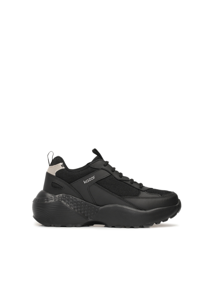 Ladies’ leather sneakers on a thick sole