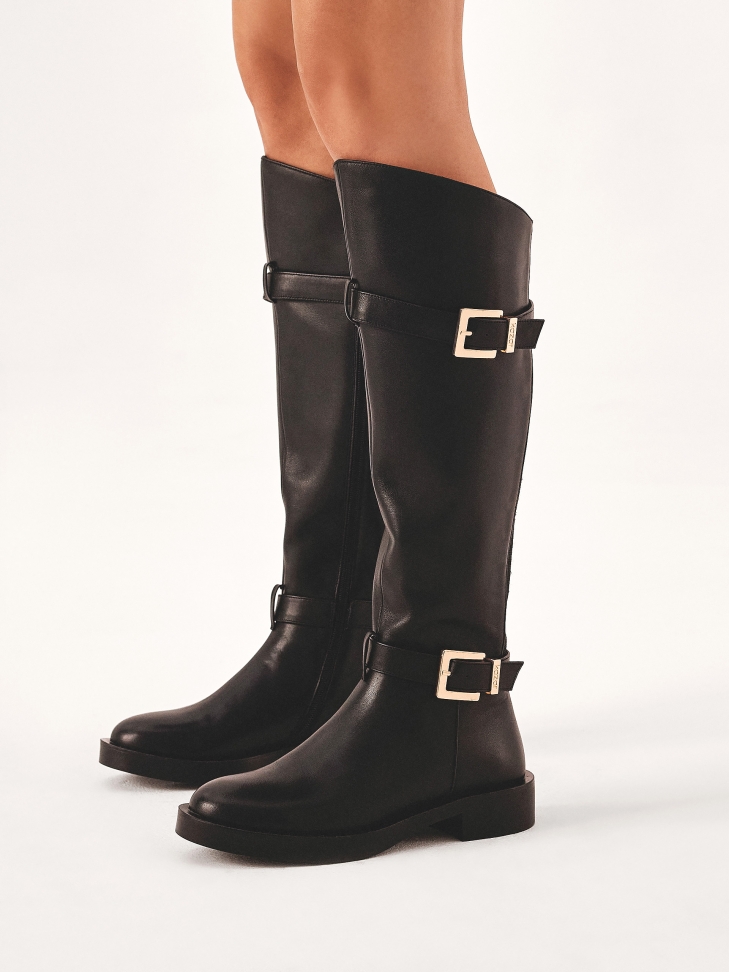 Classic black boots decorated with buckles on the upper