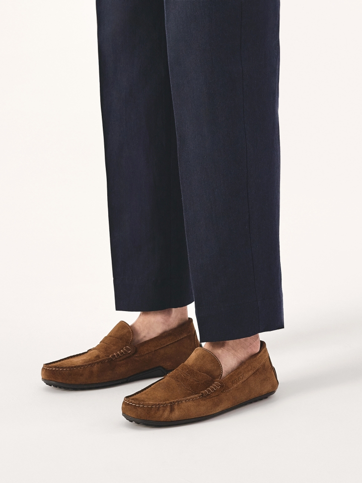 Brown suede moccasins on a comfortable sole
