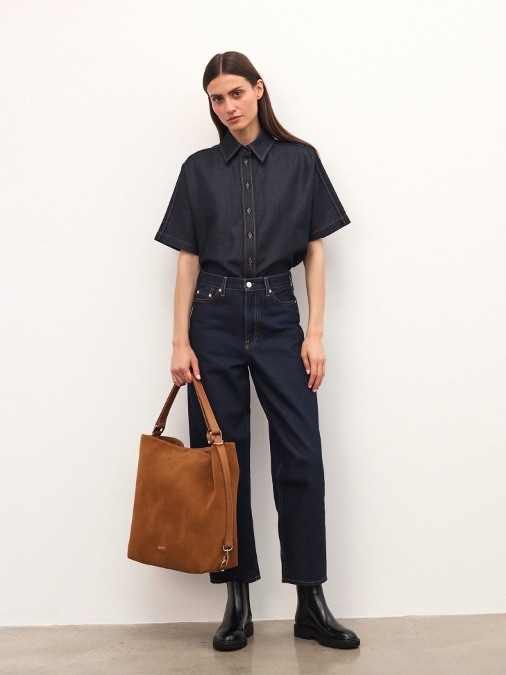 Suede handbag in light brown color with hand grip