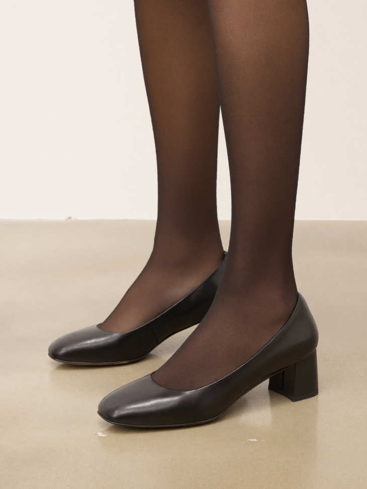 Black minimalist leather pumps