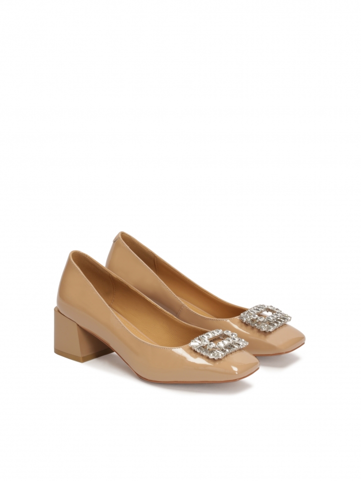 Beige pumps with jewelry embellishment