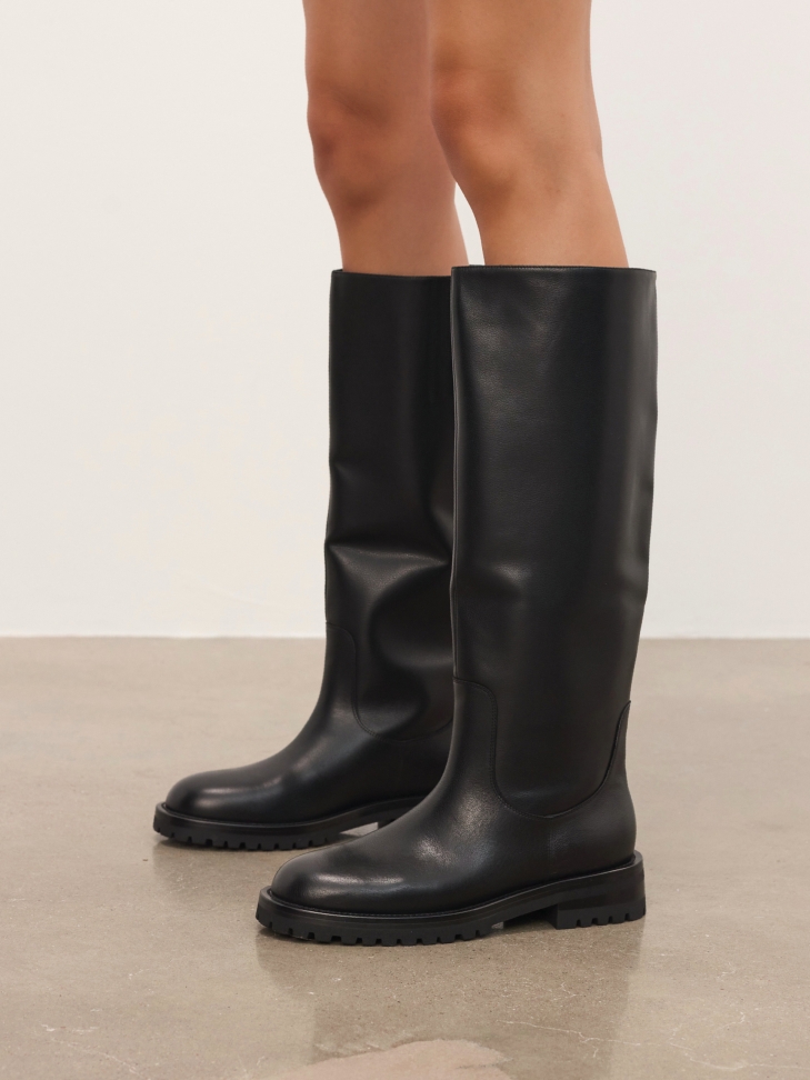 Black leather boots with slip-on upper