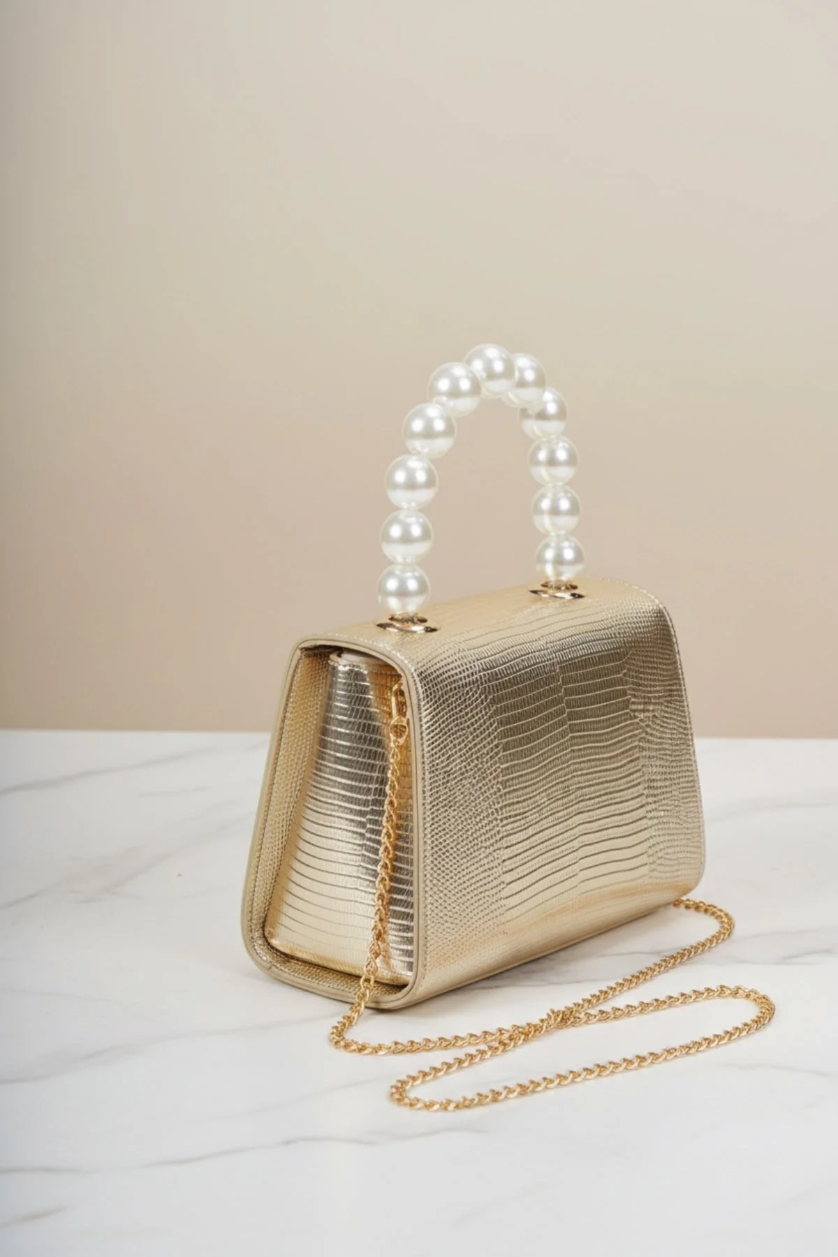 Pearl Top Handle Clutch Bag in Gold