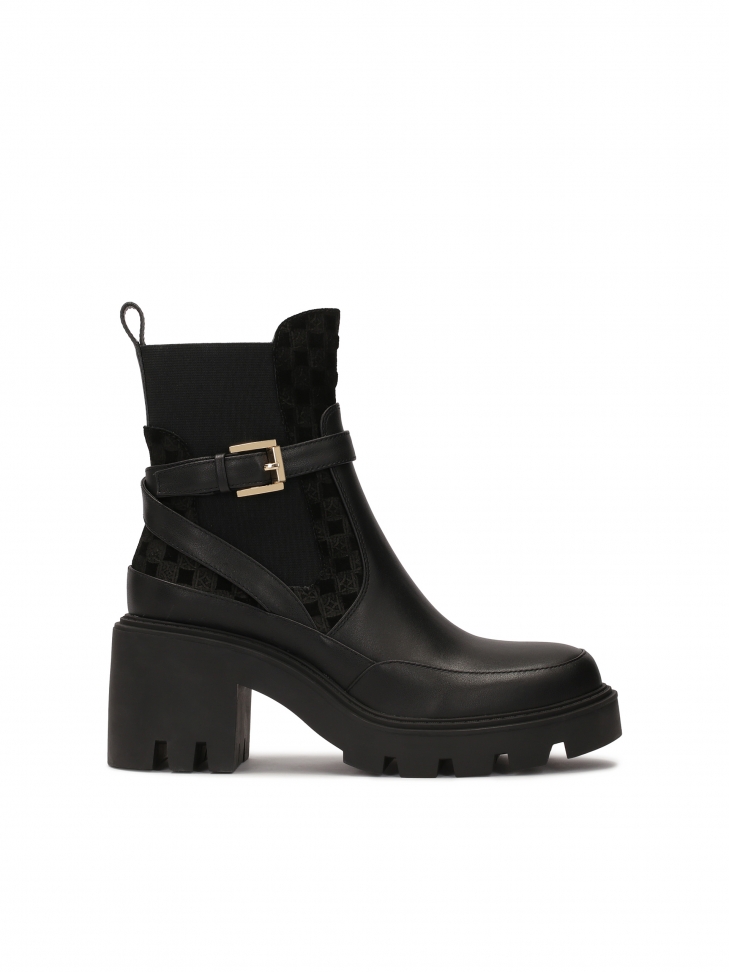 Slip-on black boots on solid sole with heel