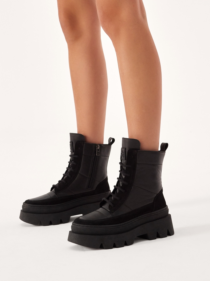 Boots made of combined materials on a thick sole