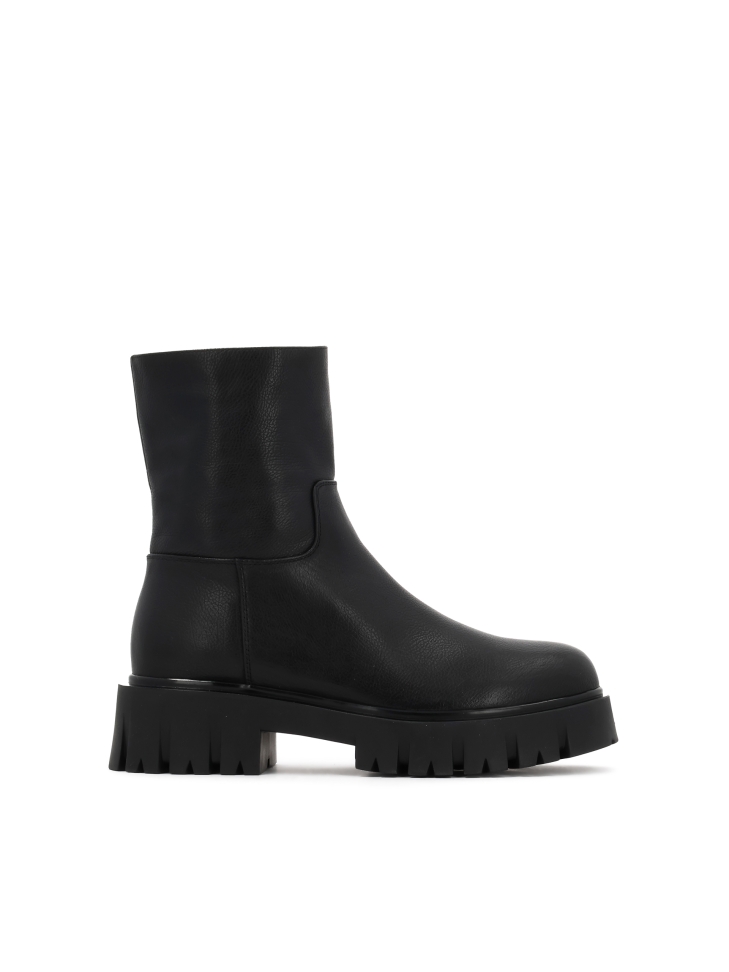 Black natural leather boots on a solid sole