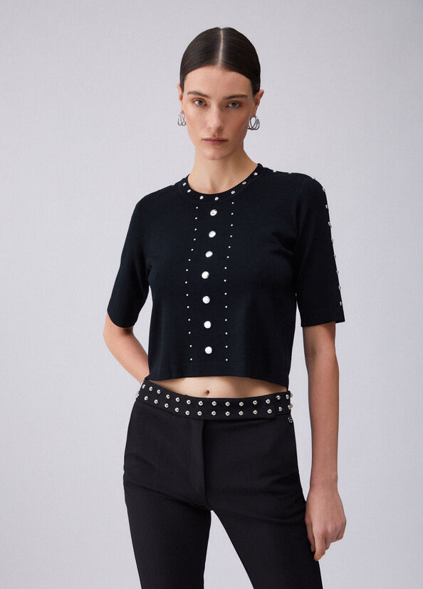 Top in maglia con borchie