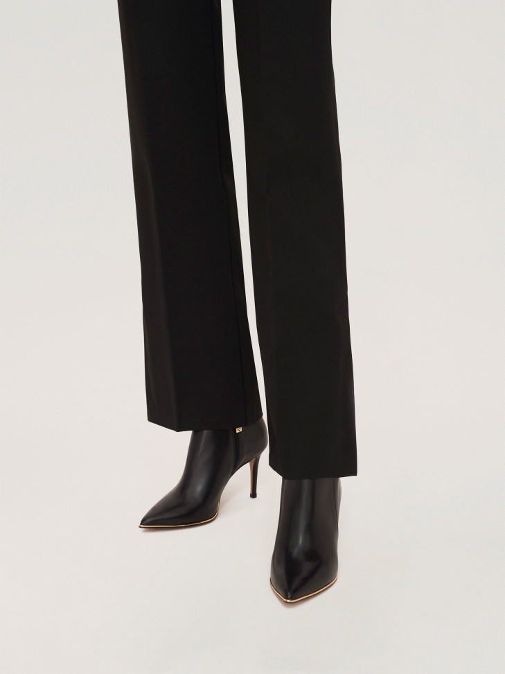 Classic black stiletto booties with a low upper