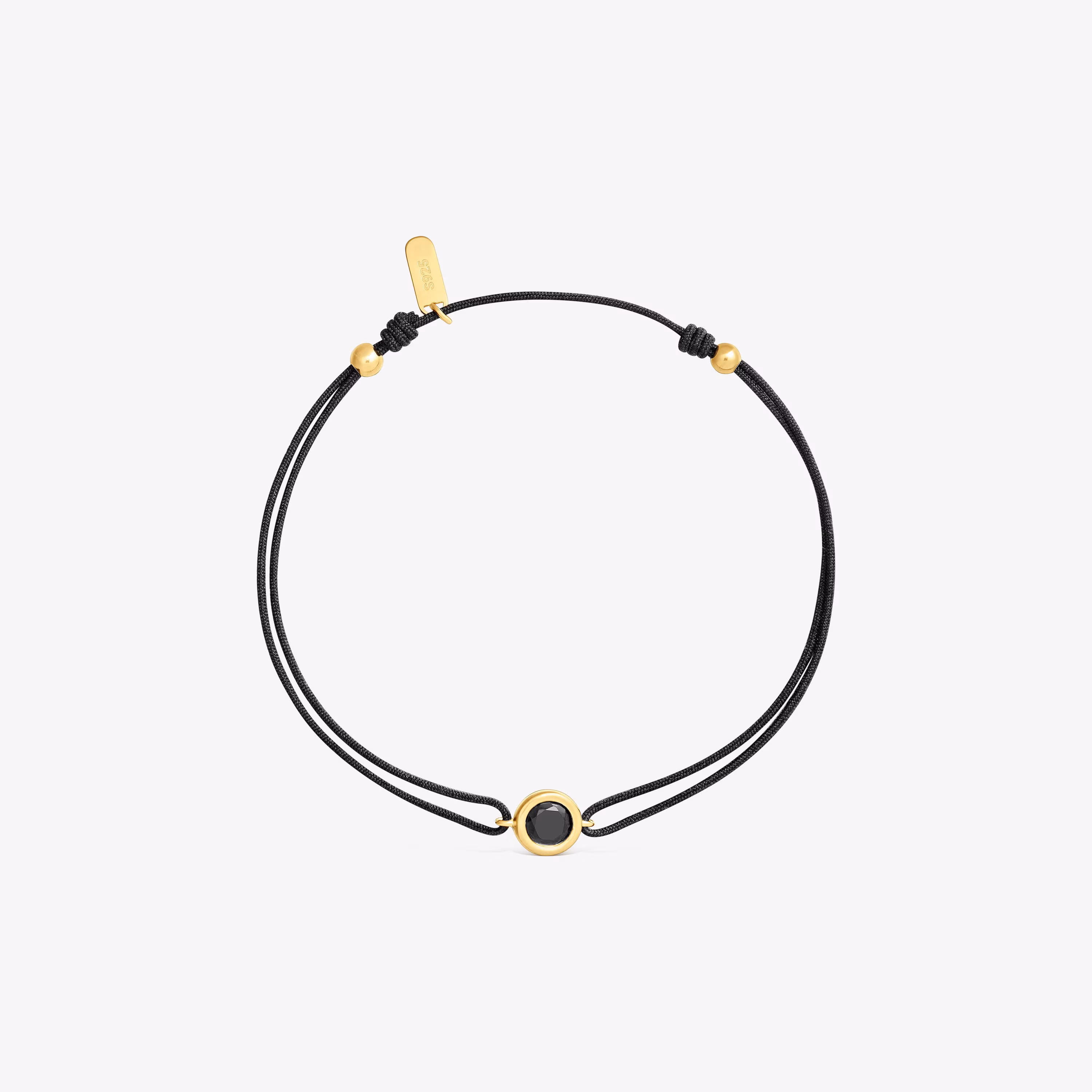 Pulsera de nylon negro con baño de oro 18 kt sobre plata y espinela negra Line
