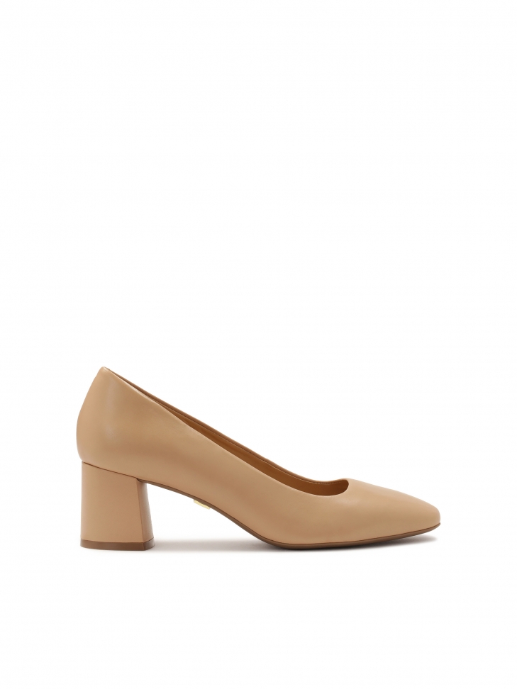 Beige pumps on a post