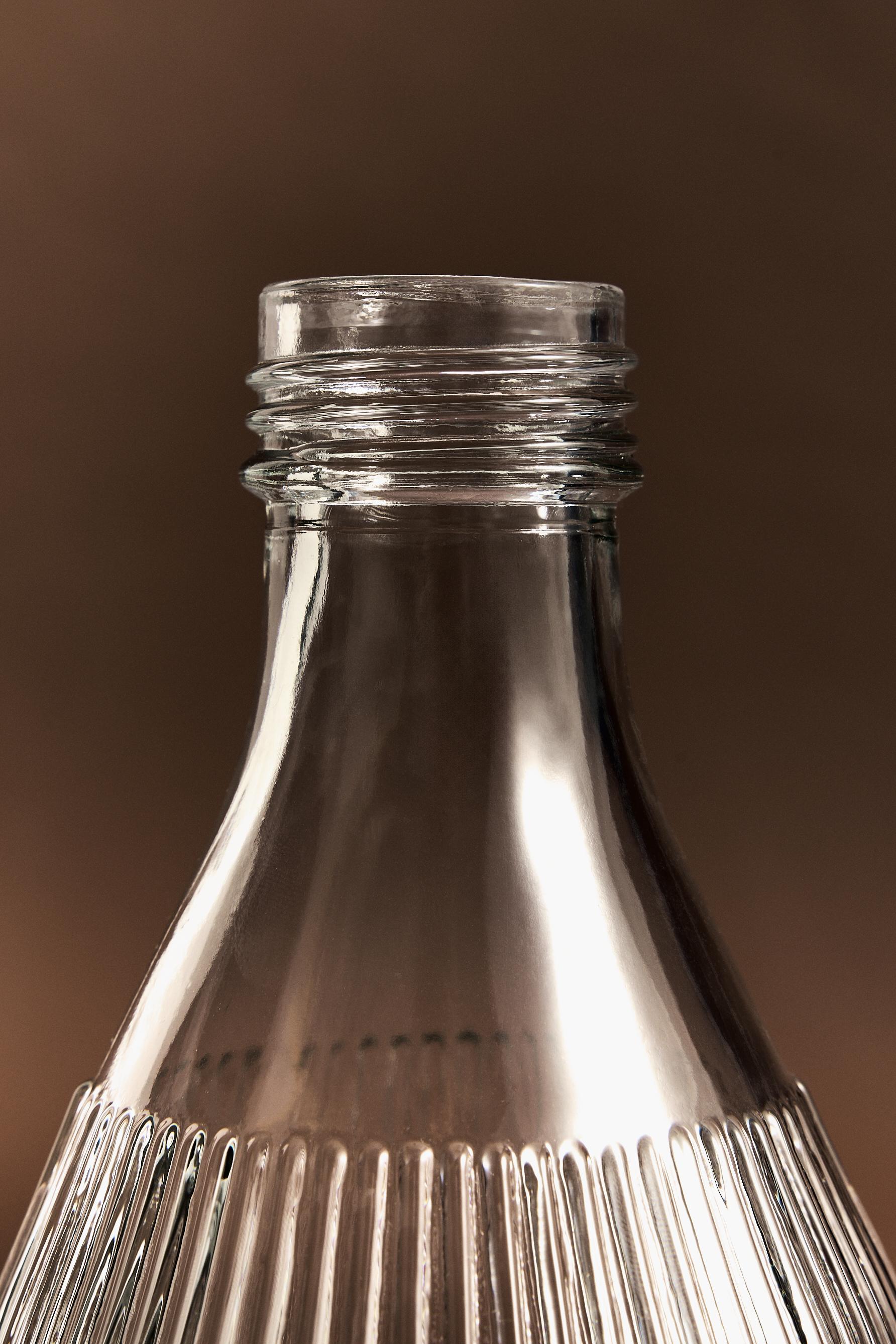 Botella vidrio rayado