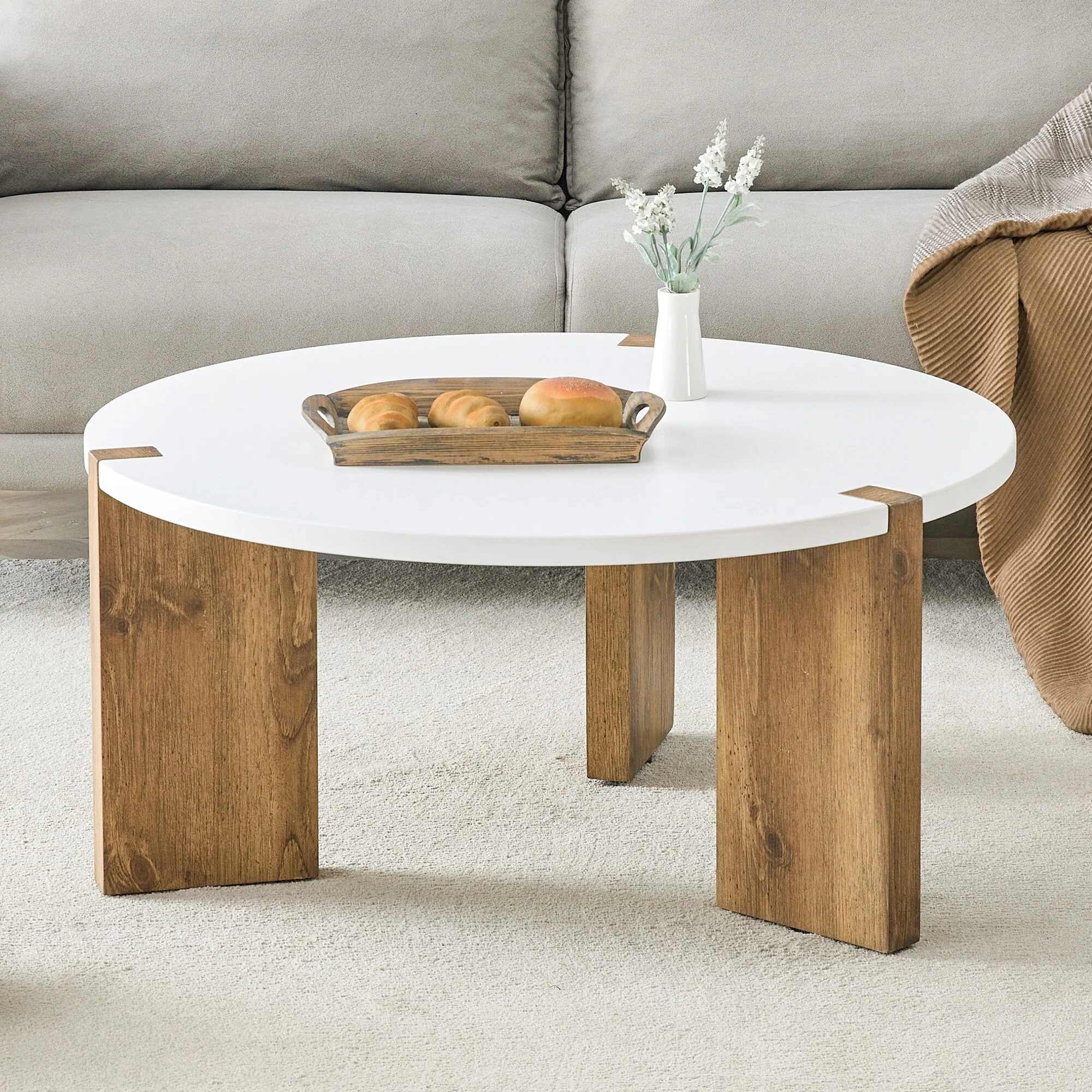 33.4-inch diameter minimalist circular MDF material coffee table. The unique embedded design and the support of three table legs