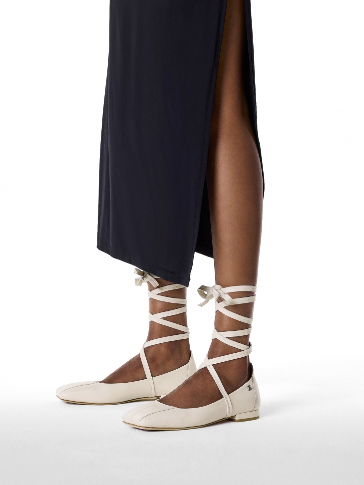 Beige pumps with binding around the ankle