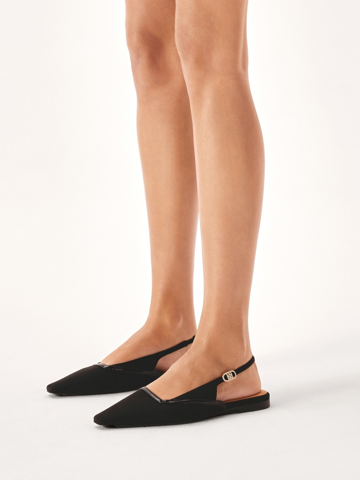 Black flat sole pumps with extended front