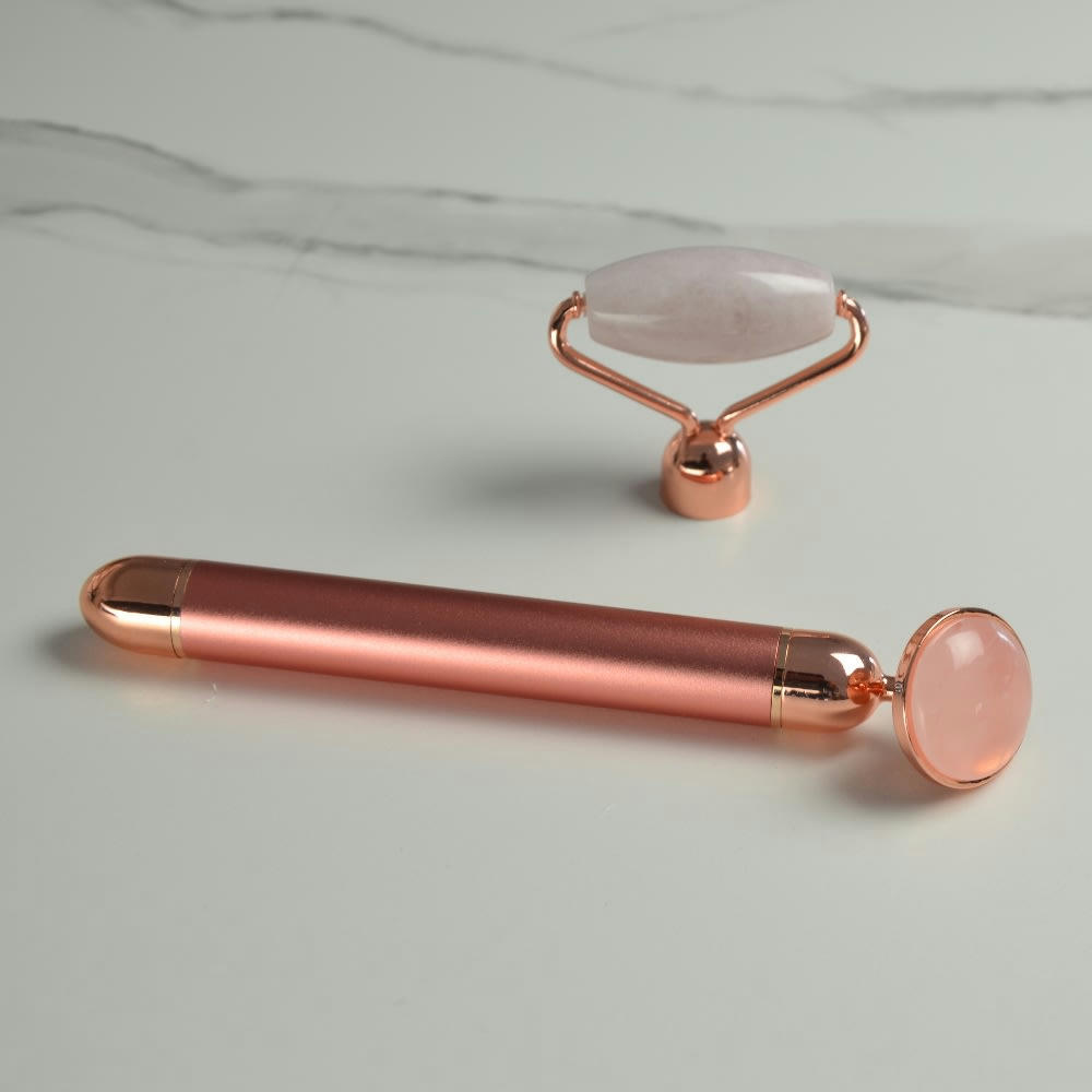 - Masseur visage électrique quartz rose