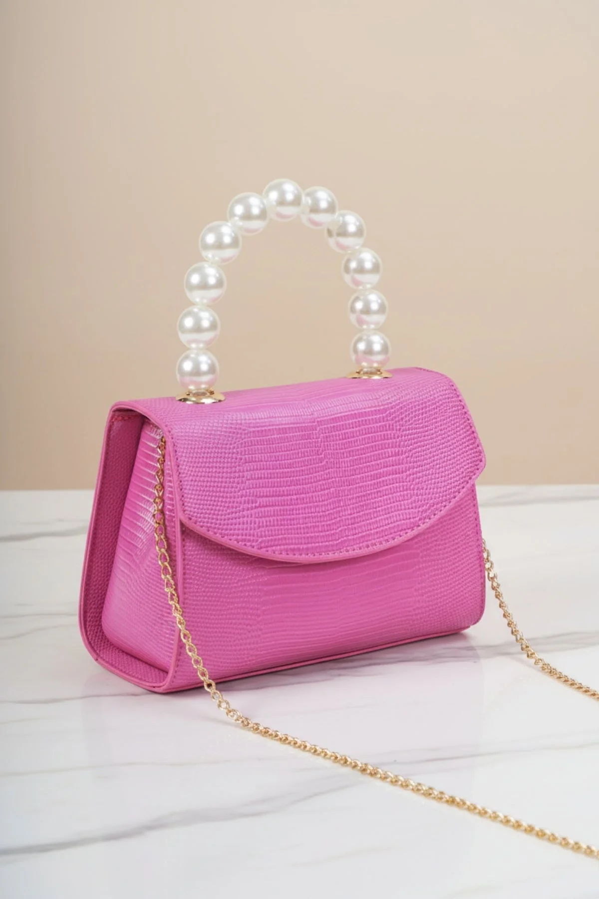 Pearl Top Handle Clutch Bag in Fuchsia Pink