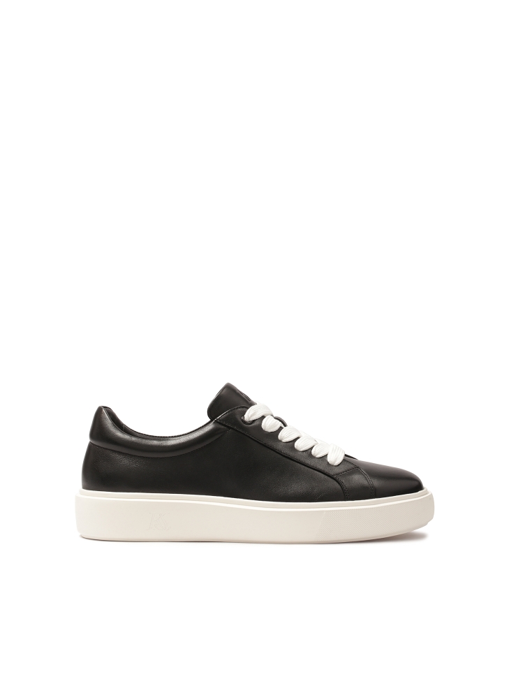 Black sneakers on contrasting sole