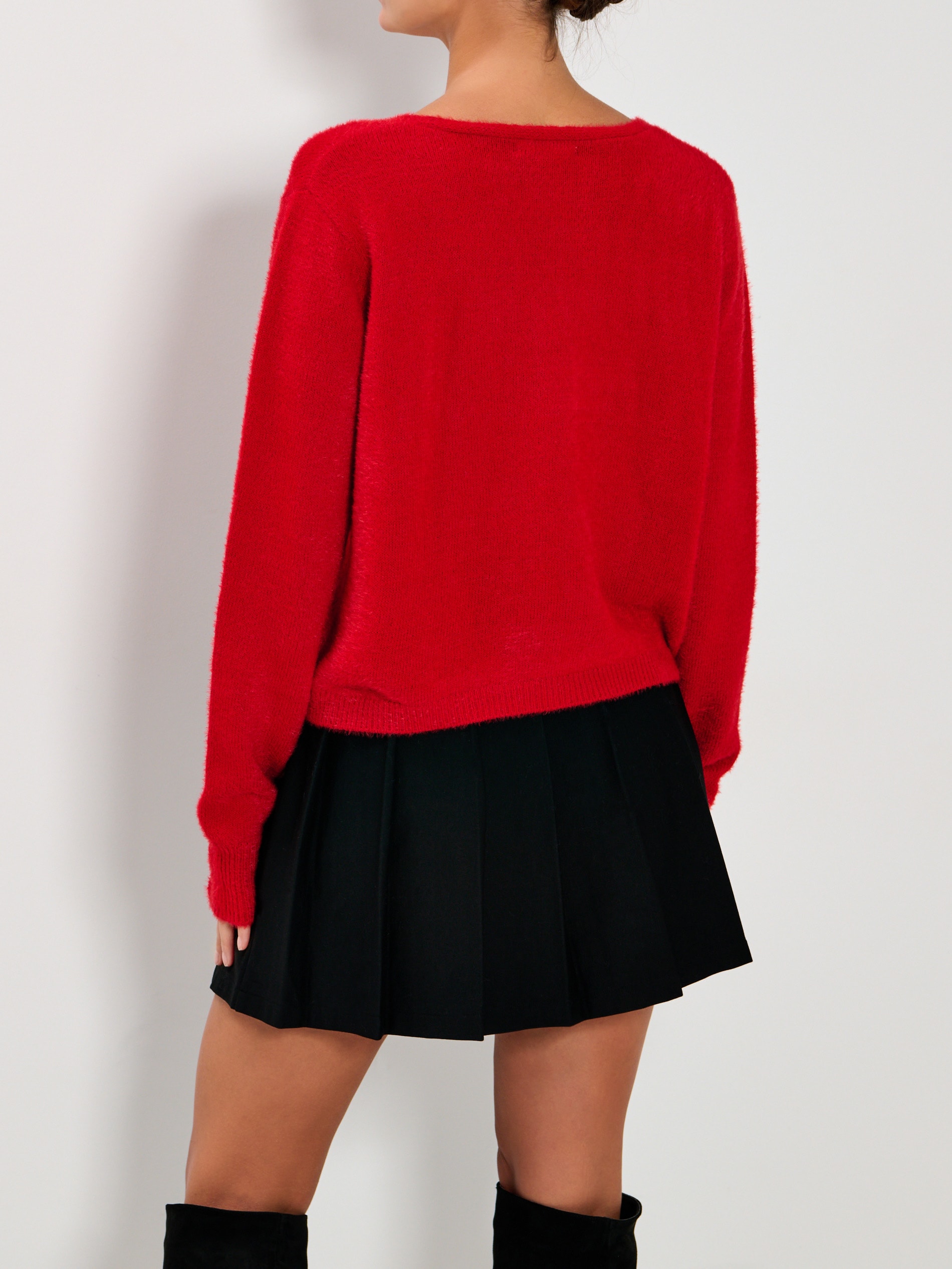 Sweter z kokardami