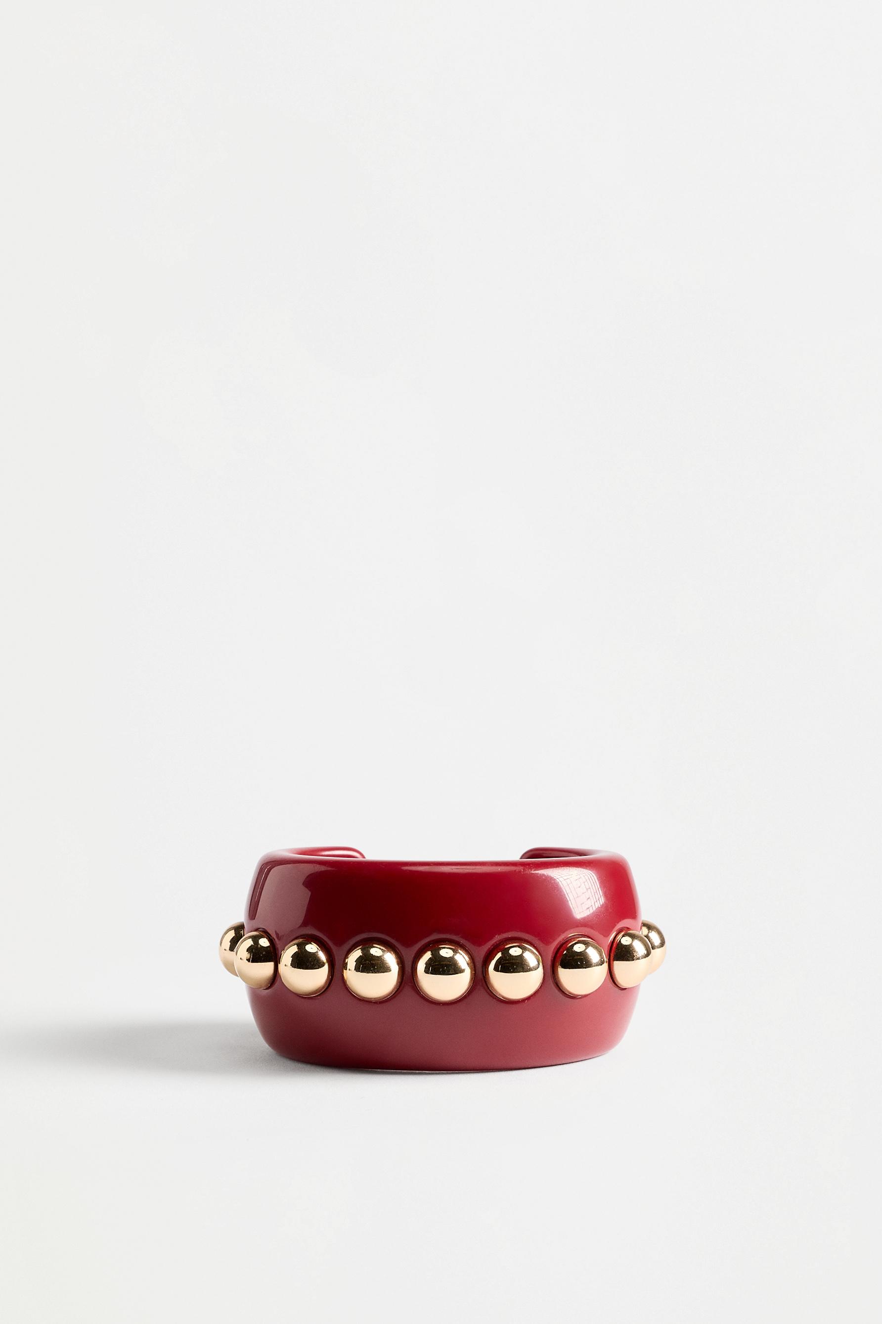 Pulsera ancha detalles dorados