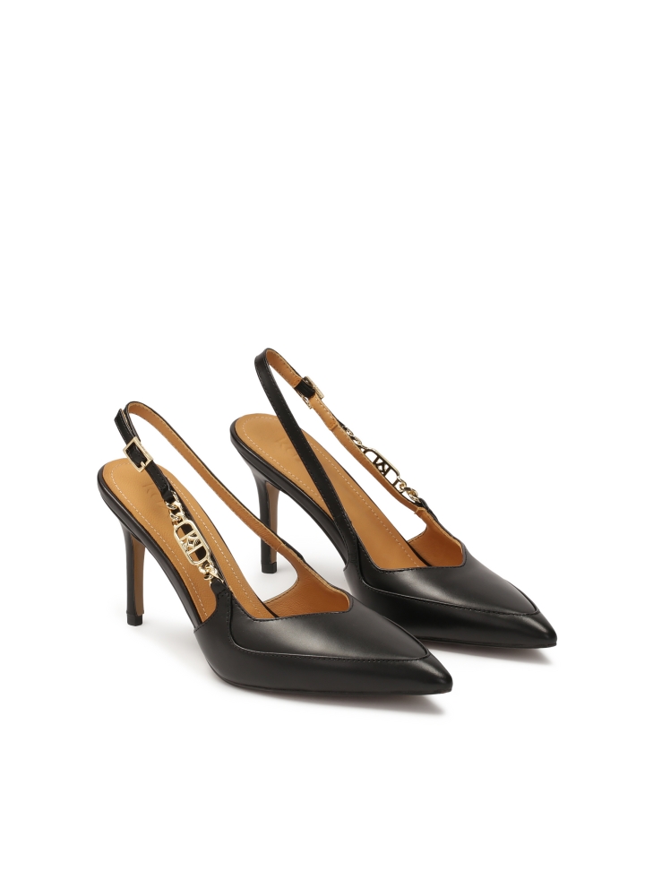 Black slingback pumps with metal monogram