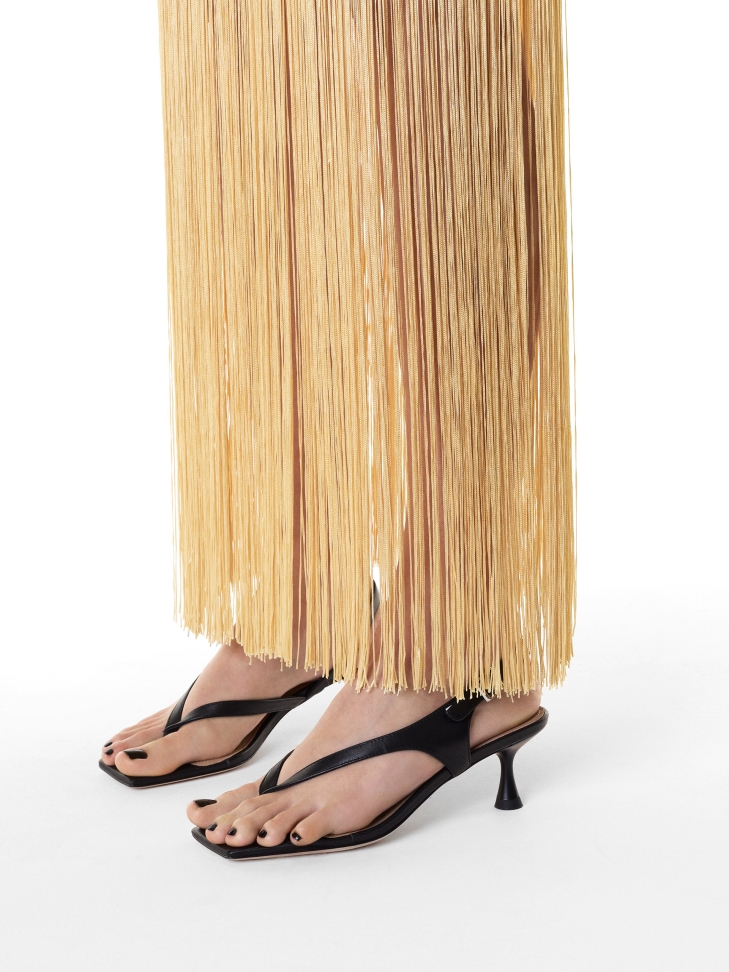 Sandals with a strap between the toes