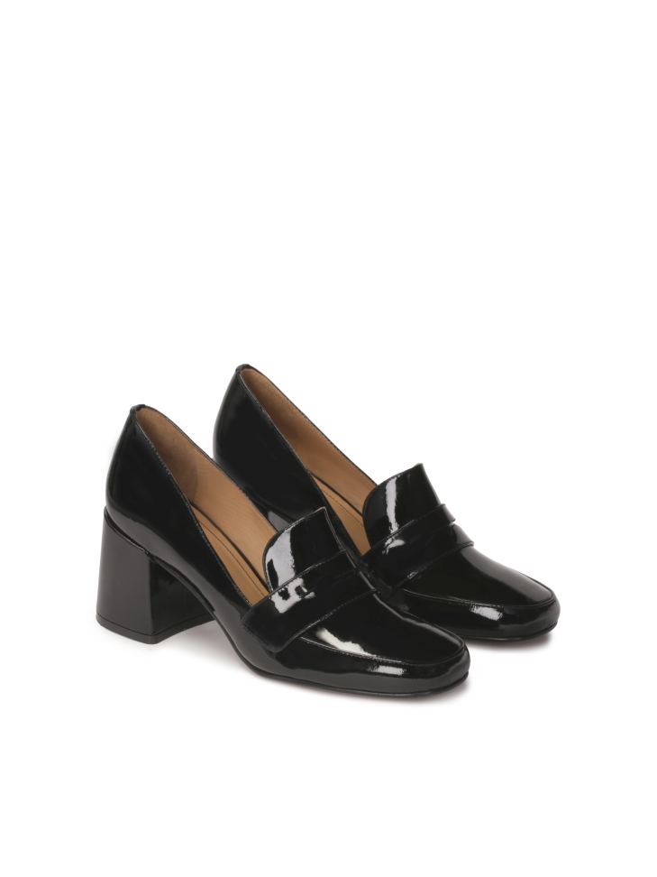 Patent leather pumps on a pole