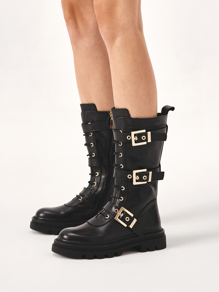 Boots with high upper and solid sole