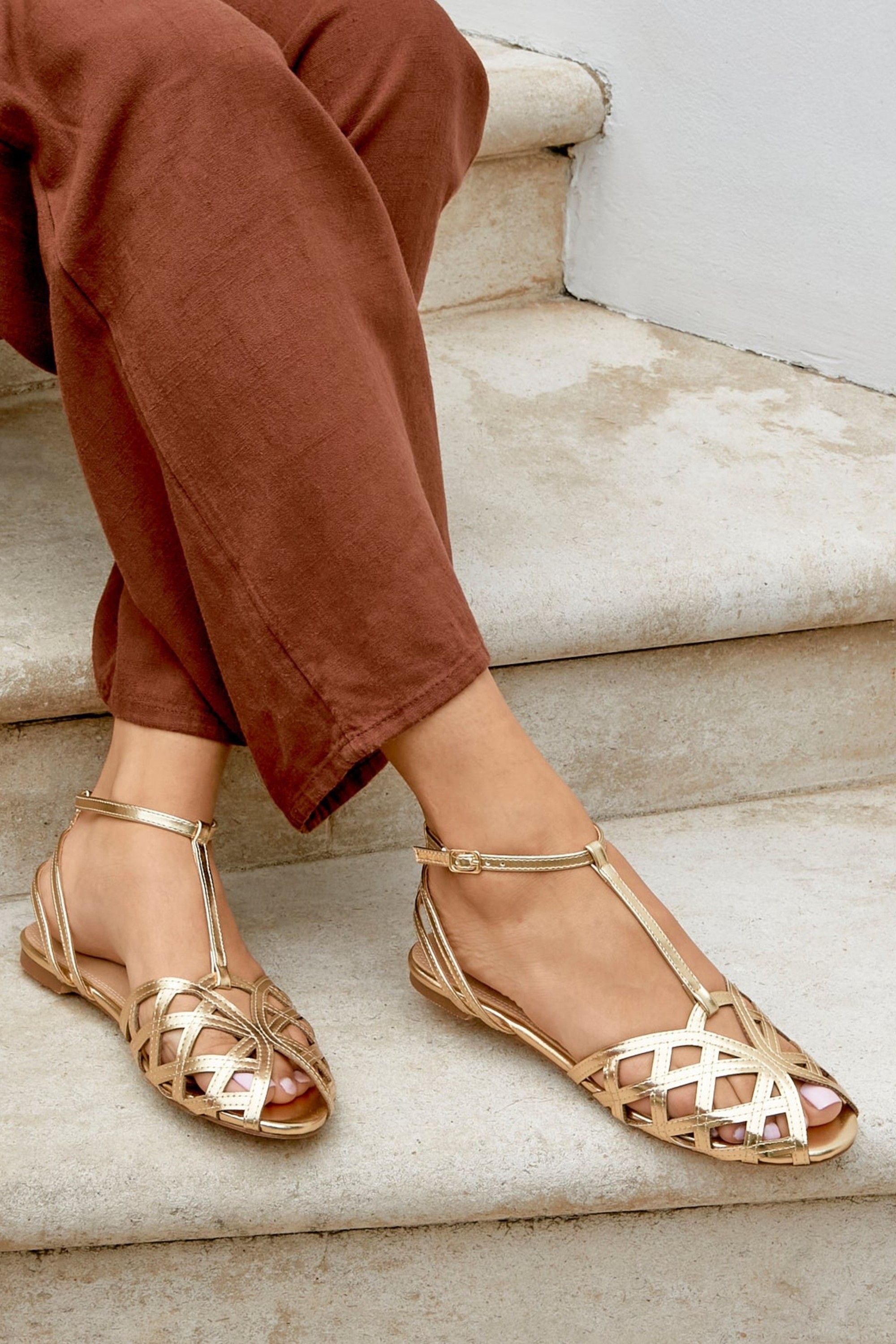 Linzi Santi Gold Caged Flat Sandals