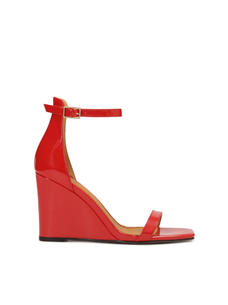Patent leather red sandals on a platform heel