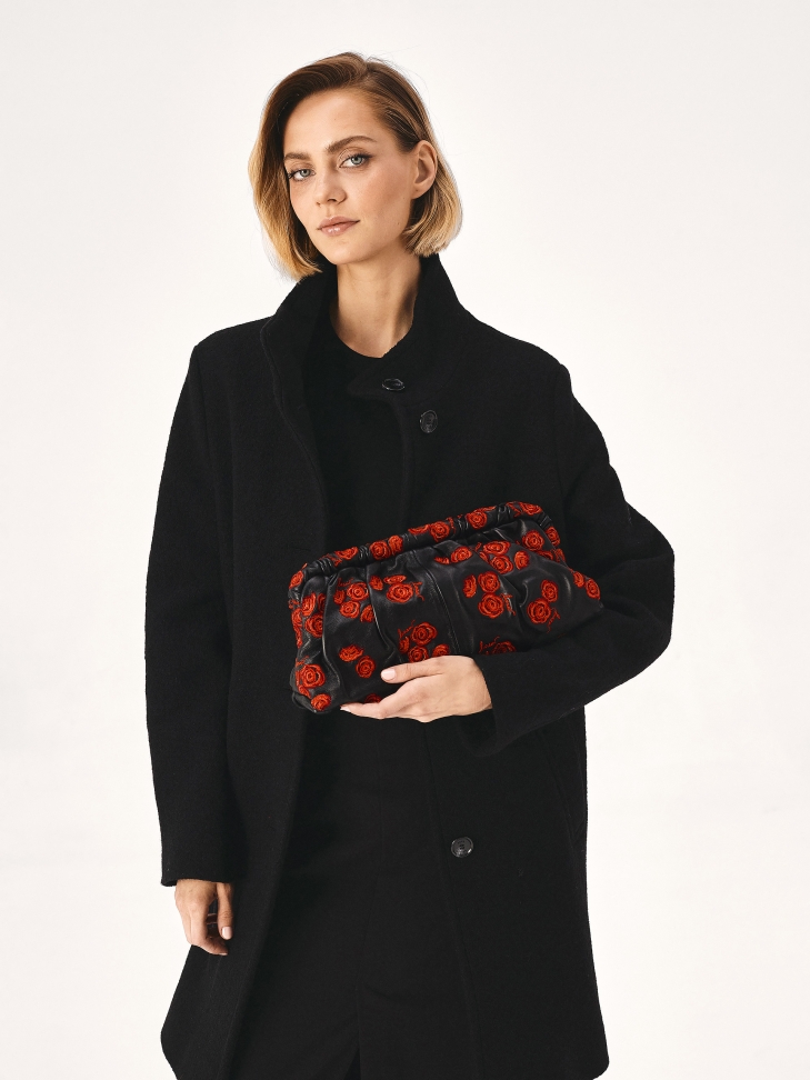 Black clutch bag with red roses