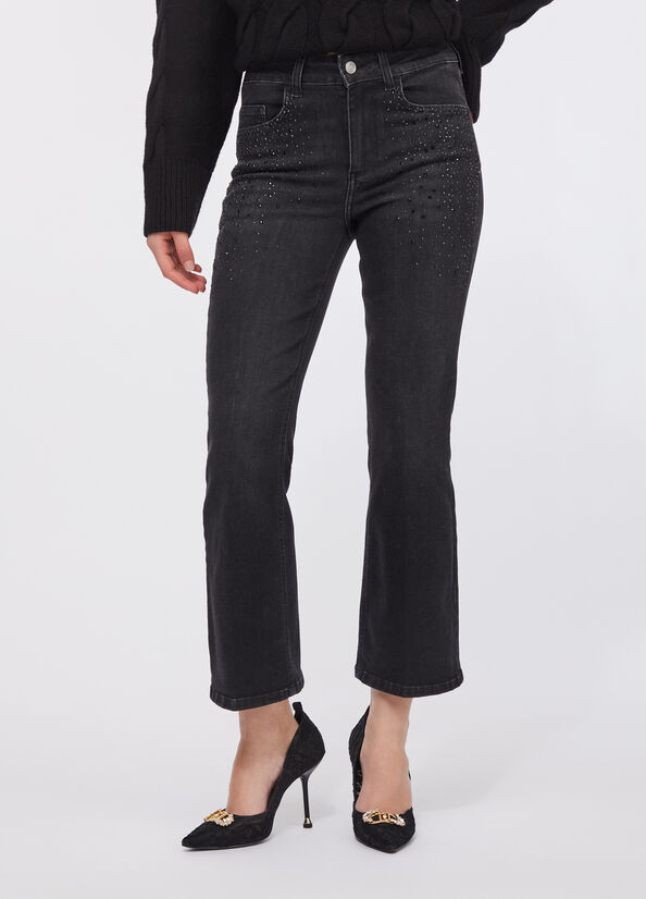 Jeans flare cropped con strass