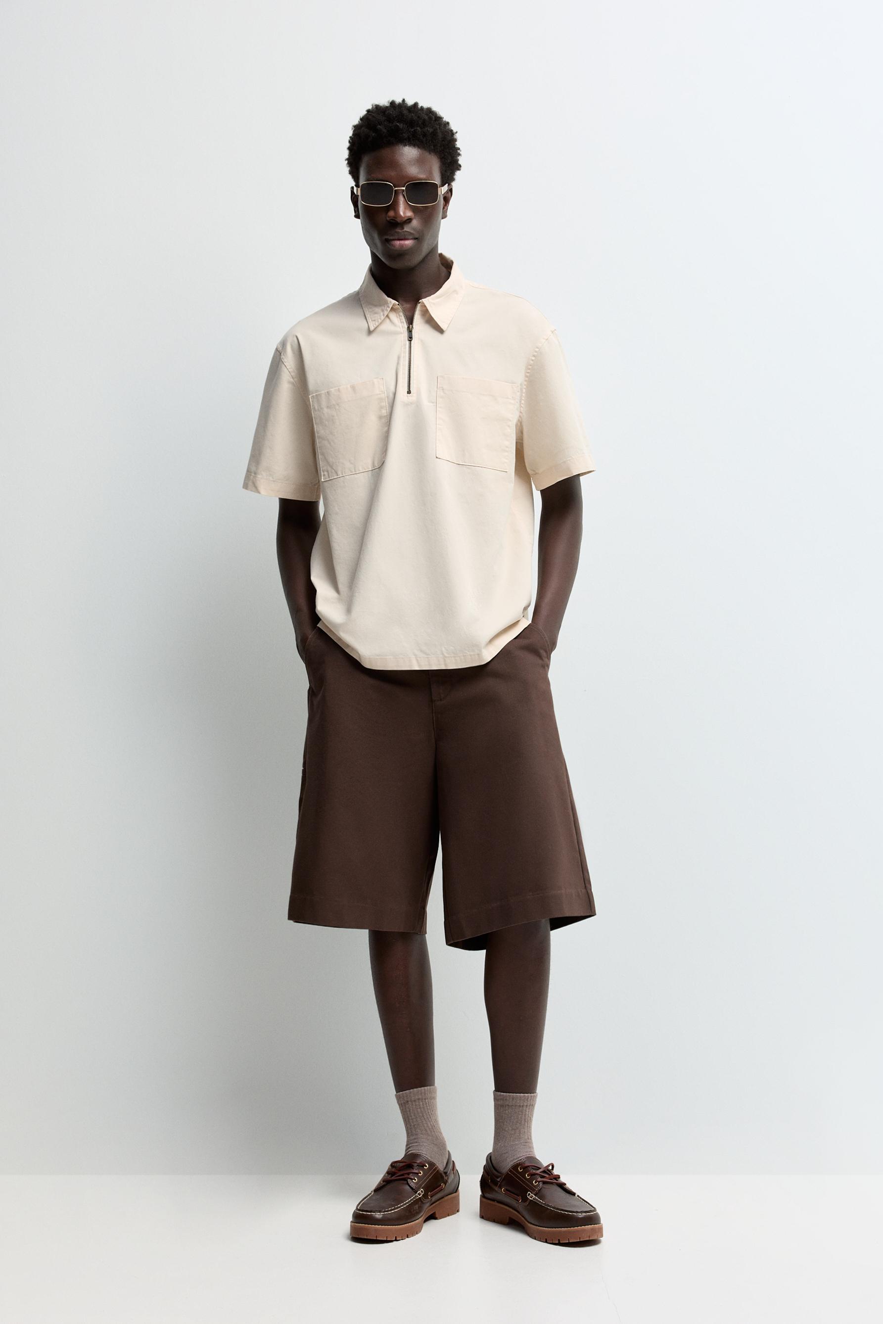 Camisa polo cremallera bolsillos