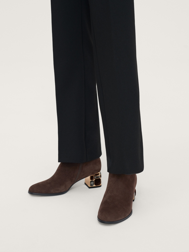 Brown suede booties with a beautifully decorated heel