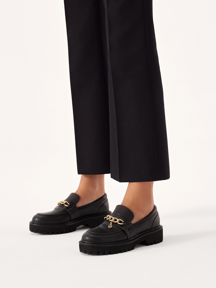 Black slip-on shoes with tag chain