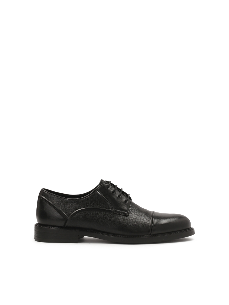 Black leather shoes with stitching