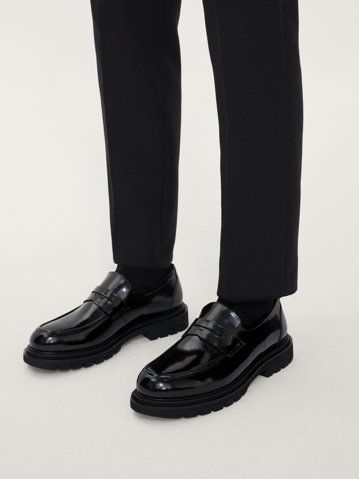 Men’s black loafers on a thick sole