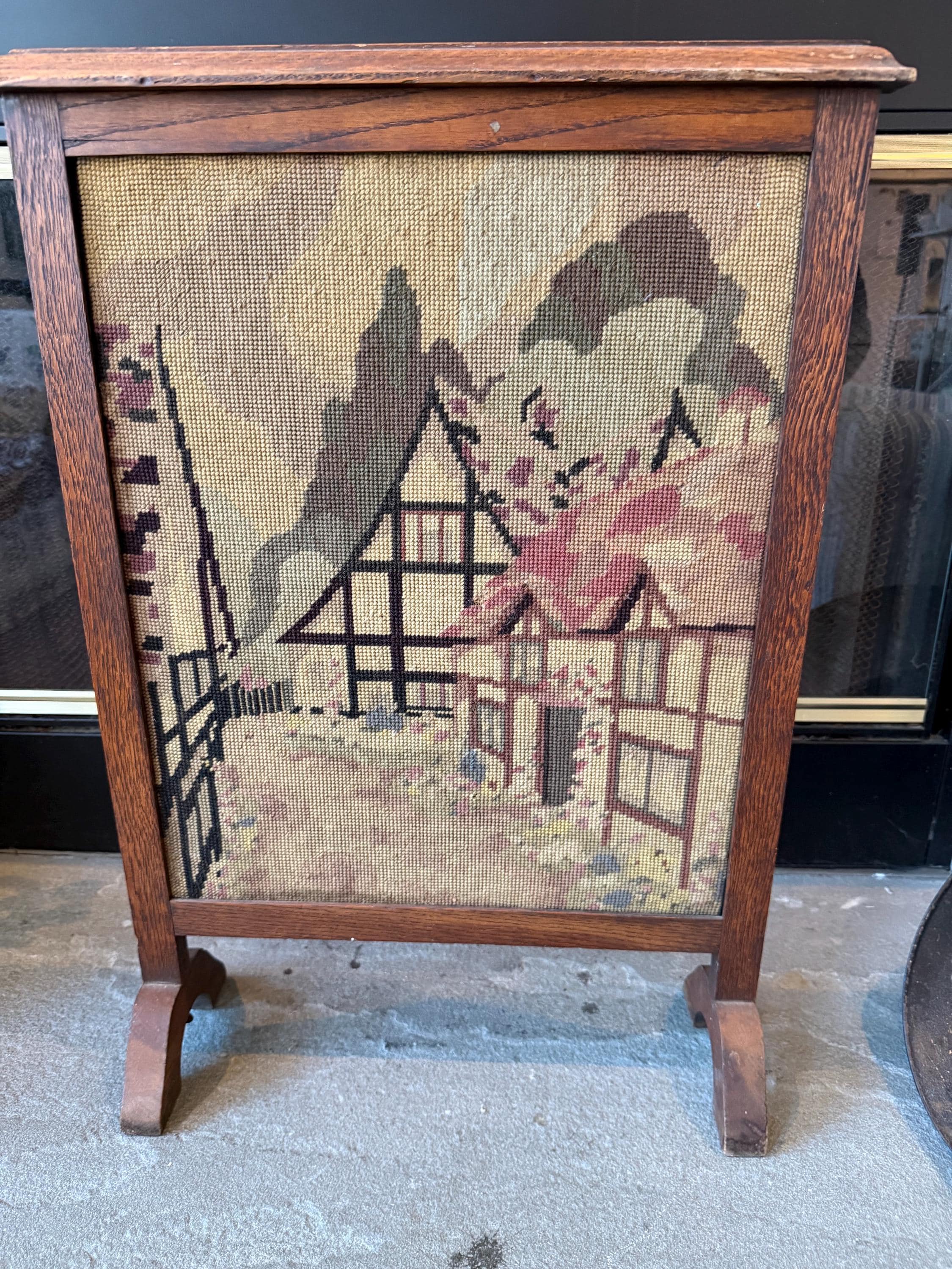 Antique Wooden Fireplace Screen with a Needlepoint Village Scene.