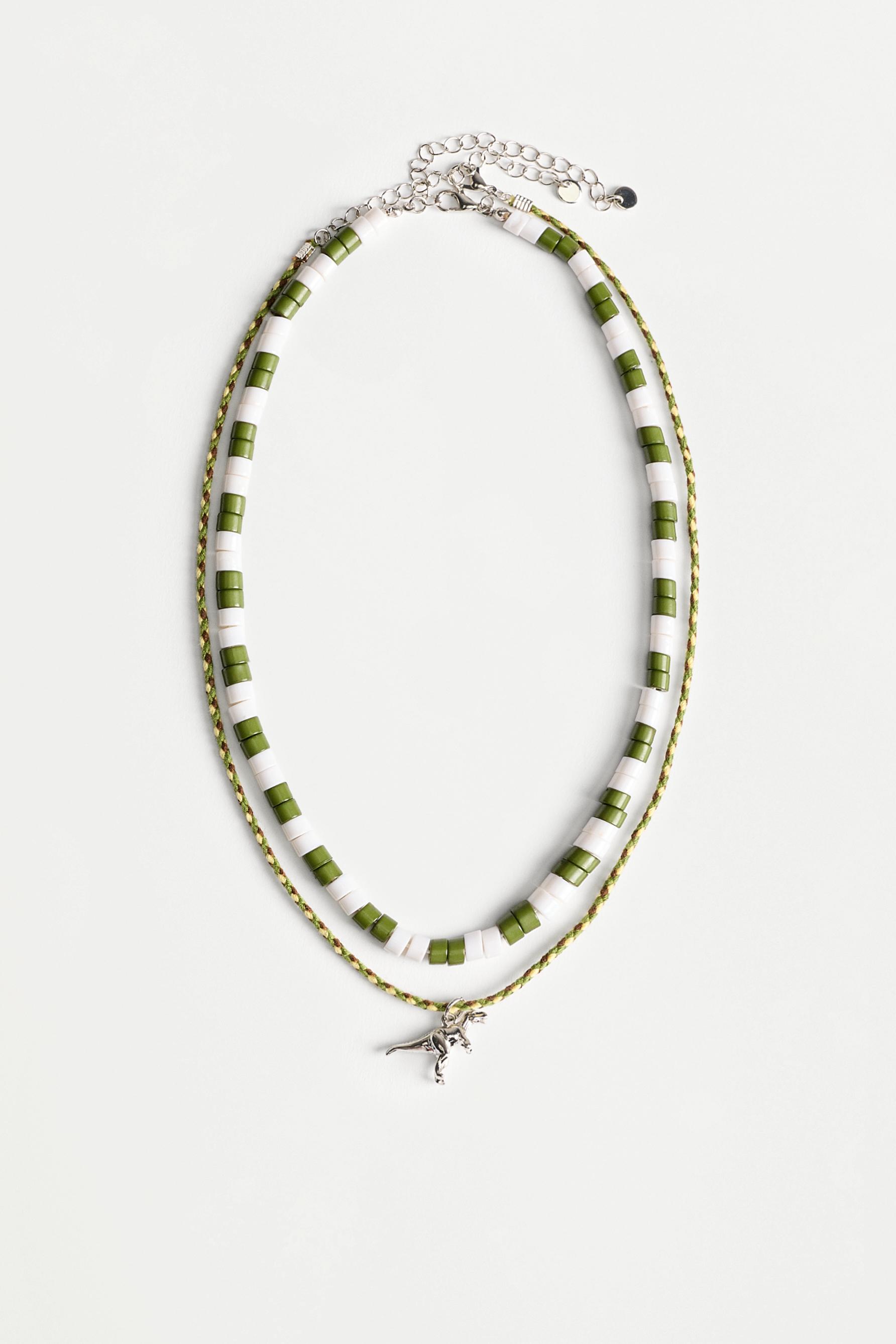 Collar doble dinosaurio