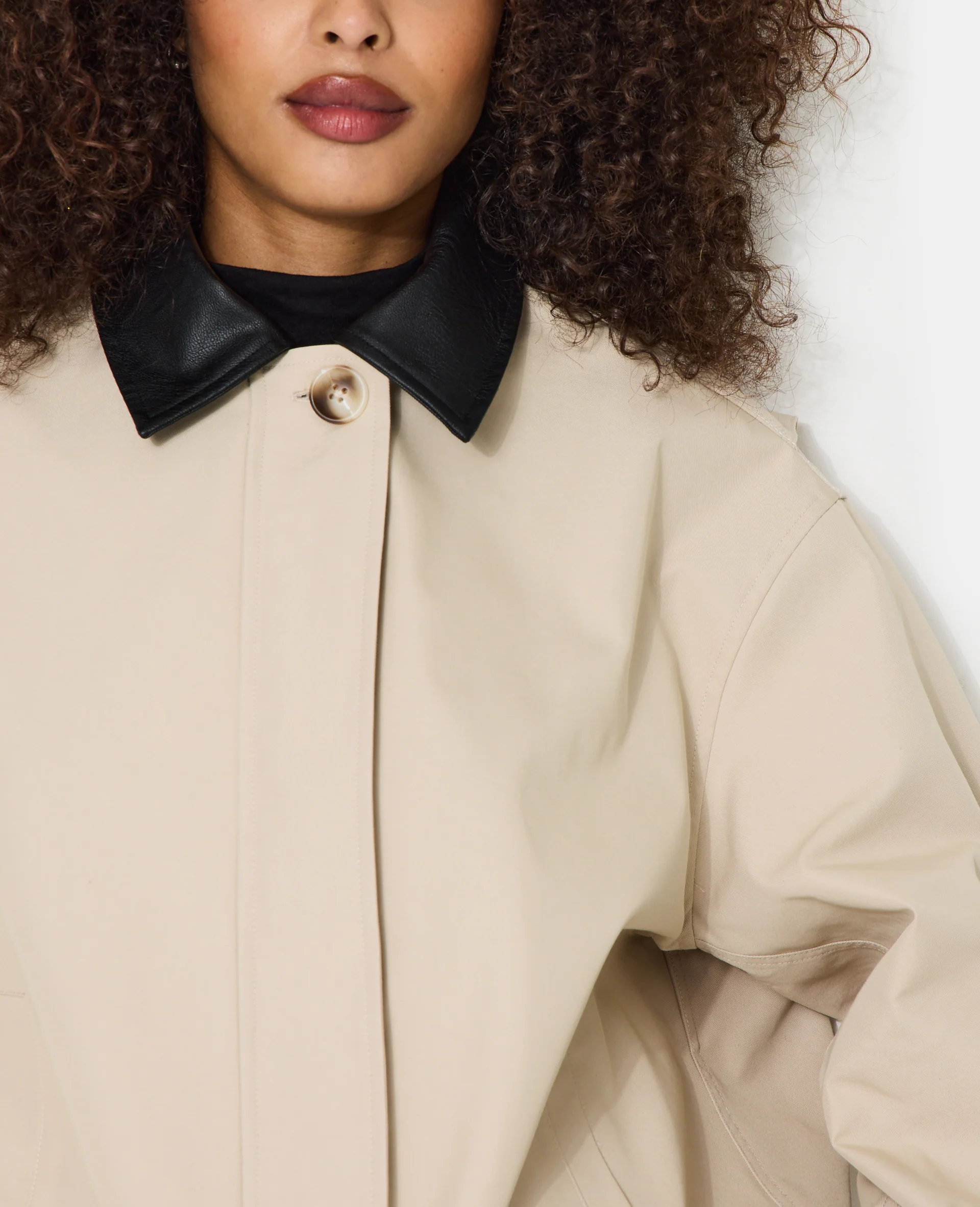 Veste col simili avec base resserrable