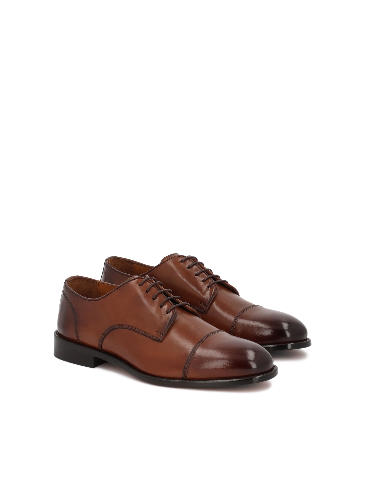 Brown shoes with overlapping toes