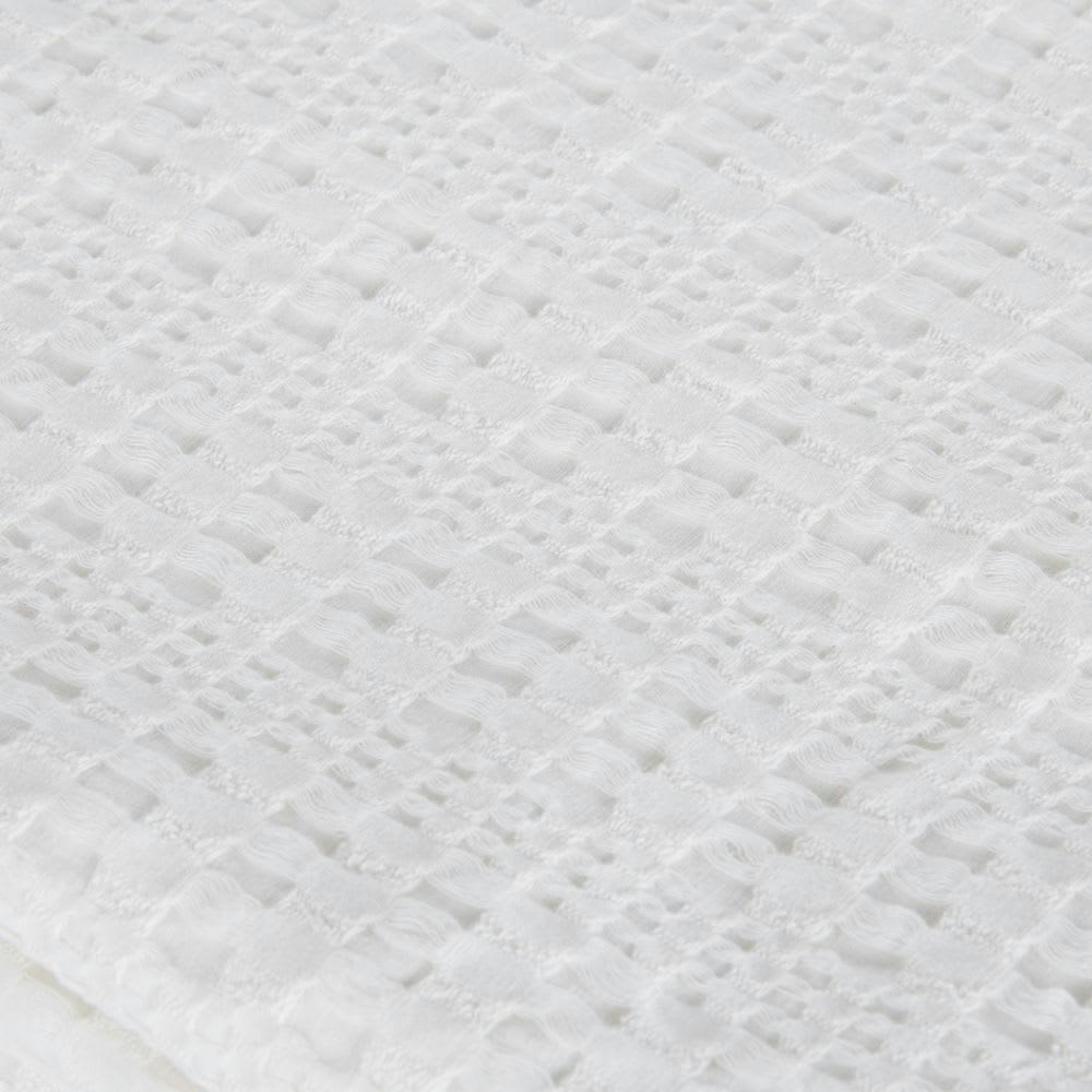 NYDIA - Plaid en coton bio gaufré blanc à franges 160x210