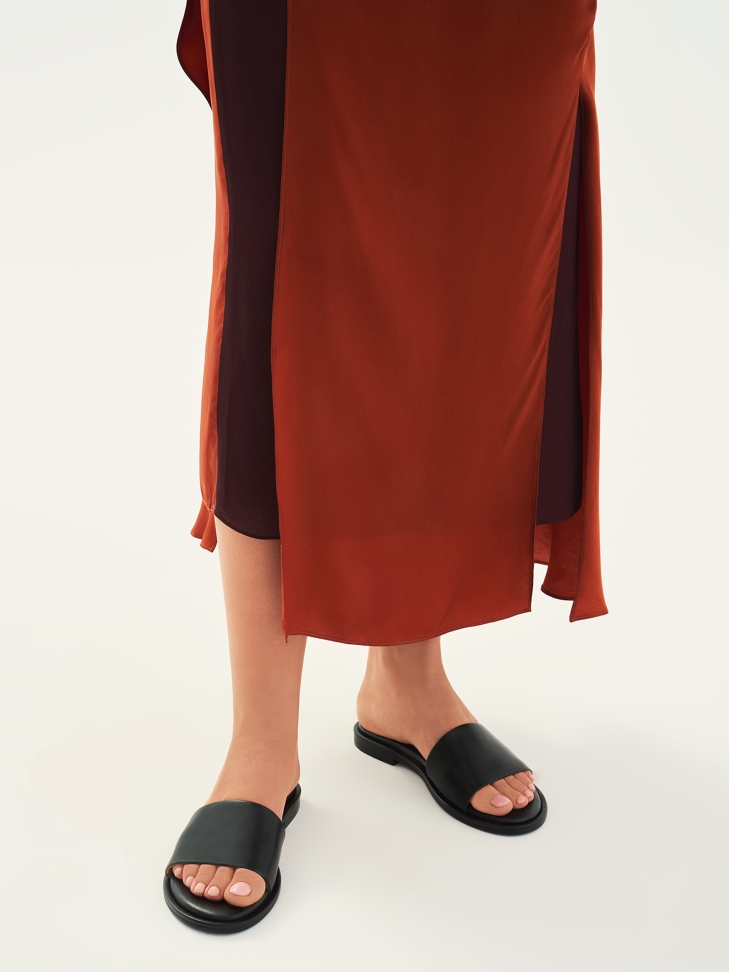 Black leather slides on a flat sole