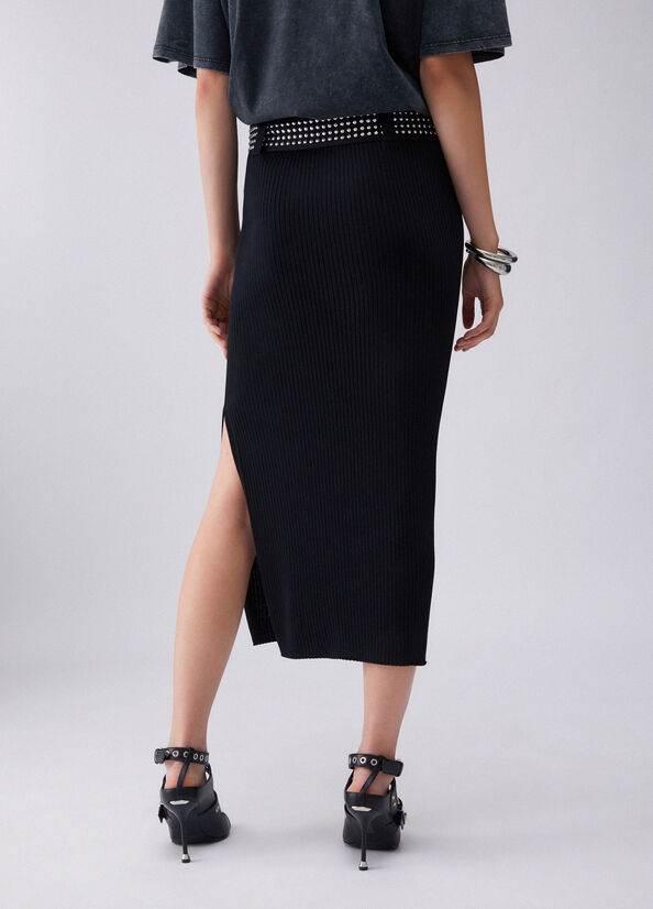 Longuette in maglia con borchie