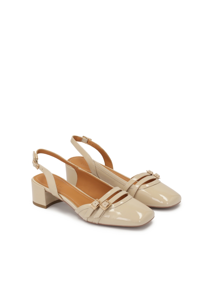Beige patent leather pumps with cut-out upper