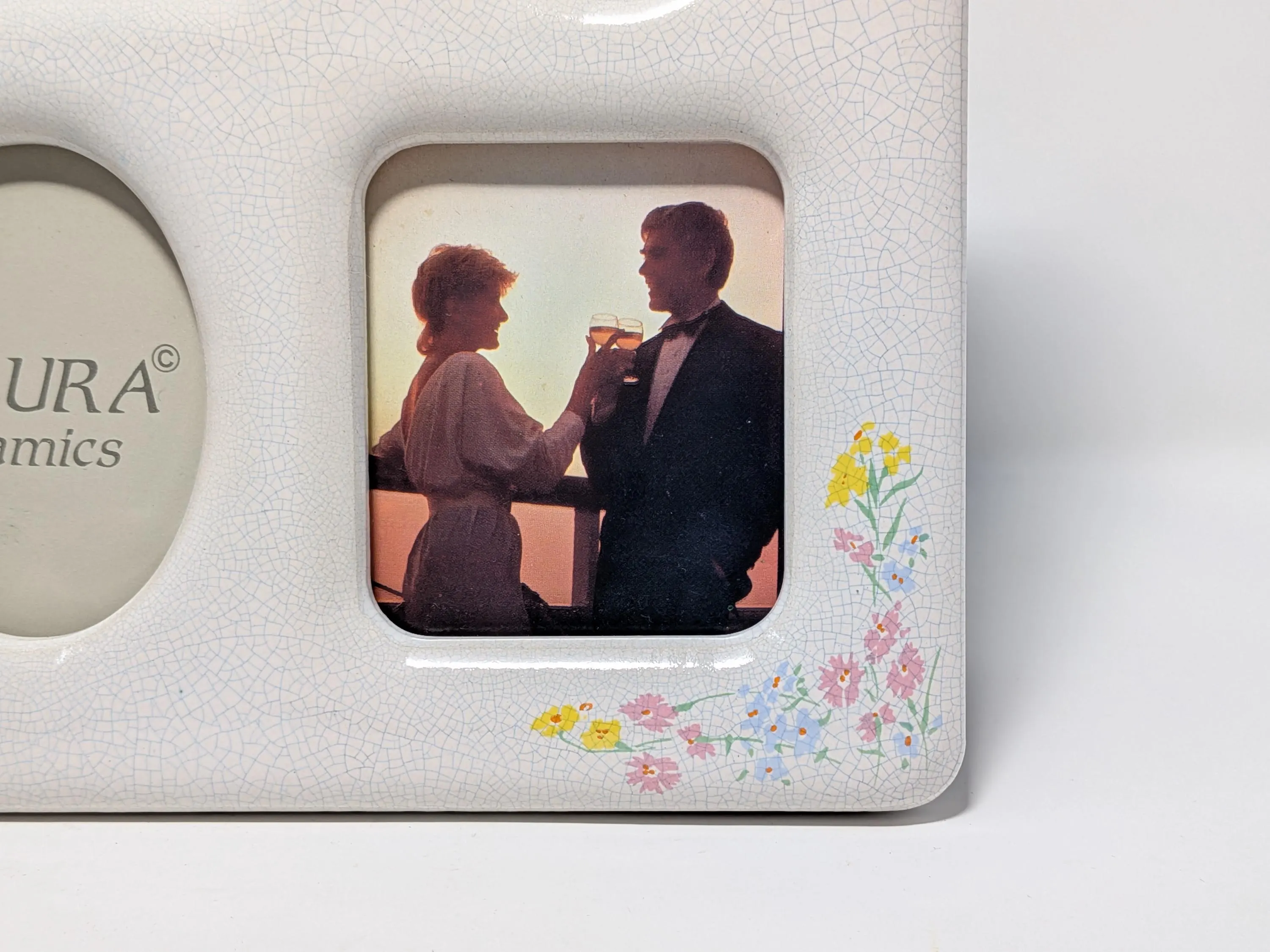 Vintage Multi-Photo frame white crackle glaze finish and delicate floral corner accents. Tabletop