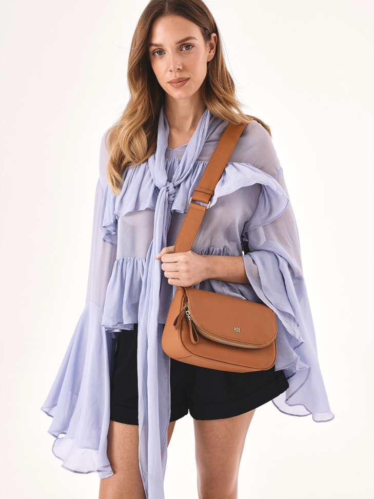 Small leather handbag on a wide strap