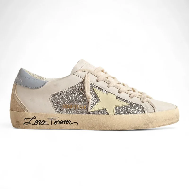 Bio-based Super-Star sneakers with silver glitter and a yellow leather star