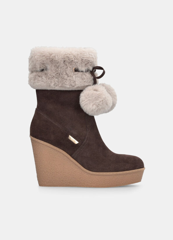 Stivaletti con zeppa e pompon