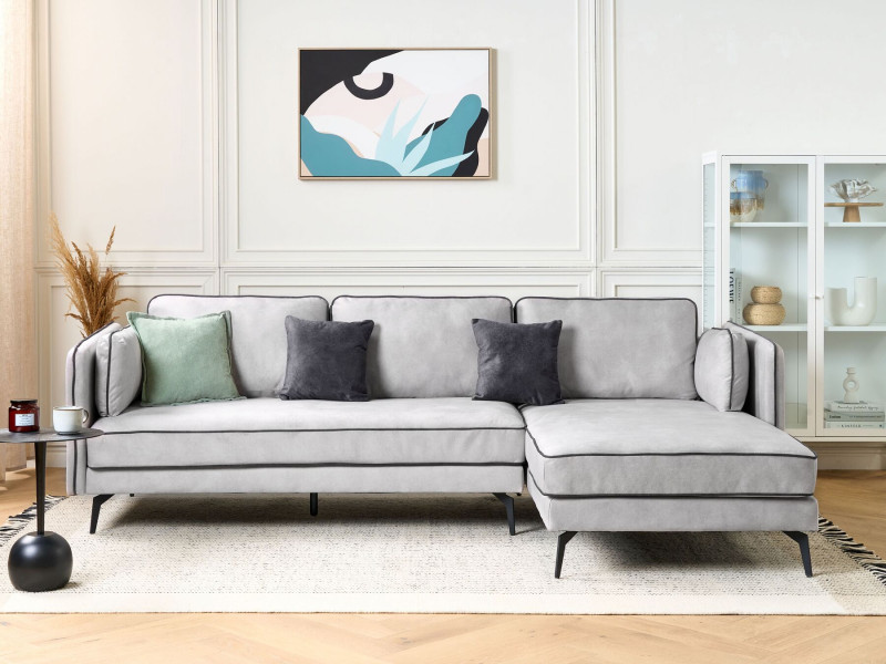 Tapicerowana sofa narożna z poduchami jasnoszara
